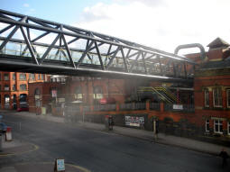The bridge to Deansgate railway station from the nearby stairs down to Deansgate