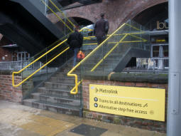 The stairs up to the platforms from Whitworth Street West