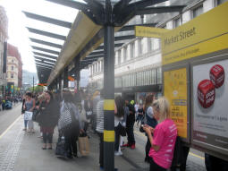 Looking along the platform for trams via Shudehill